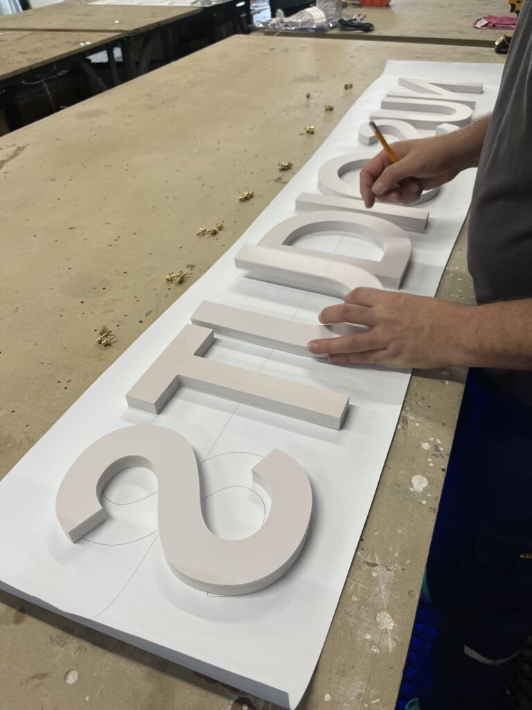 Tanning salon signage manufacturing komacel letters